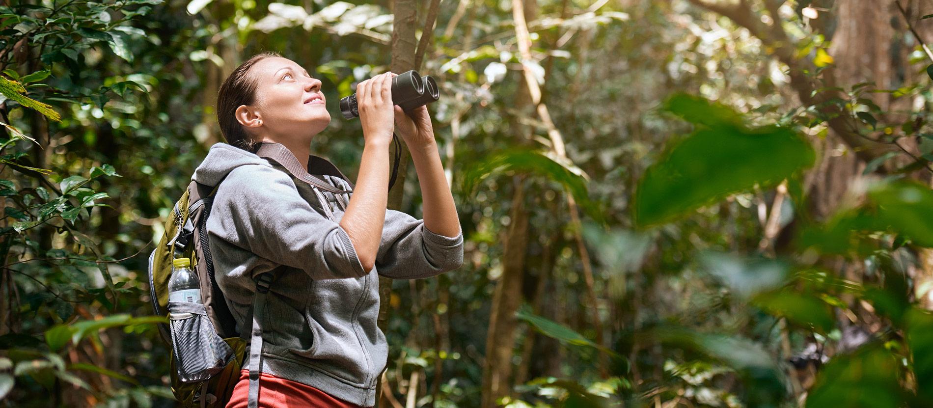 Guests walking through a scenic Tanzanian landscape
