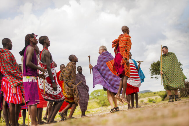 Maasai warriors performing a traditional dance at sunset, showcasing the cultural vibrancy of Tanzania.