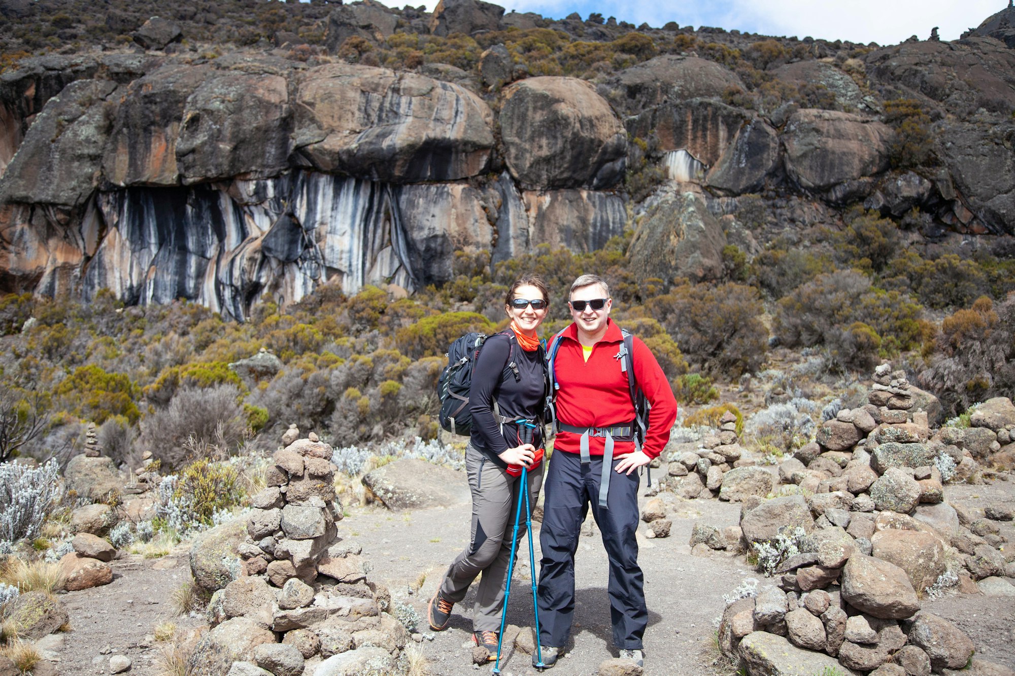 Couple backpackers on the trek to Kilimanjaro mountain