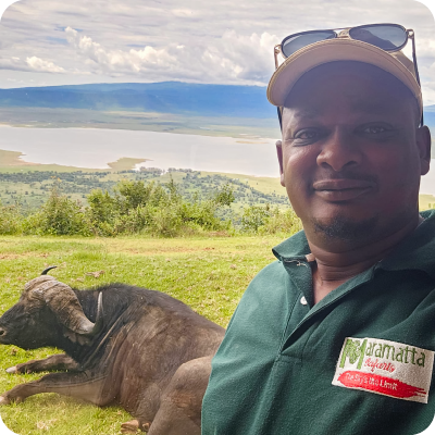 maramatta safaris transport manager taking a selfie with the buffalo in the background