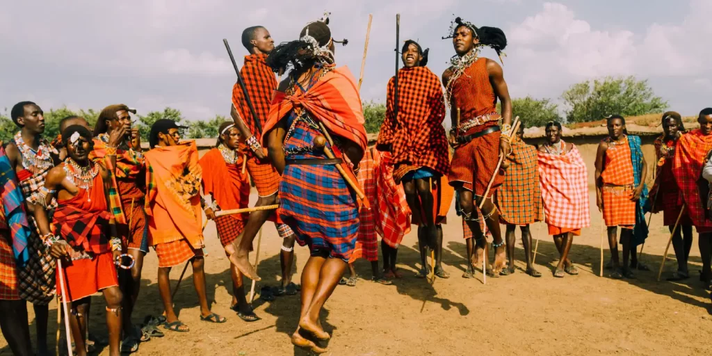 masai worriors dancing by jumping in a masai way