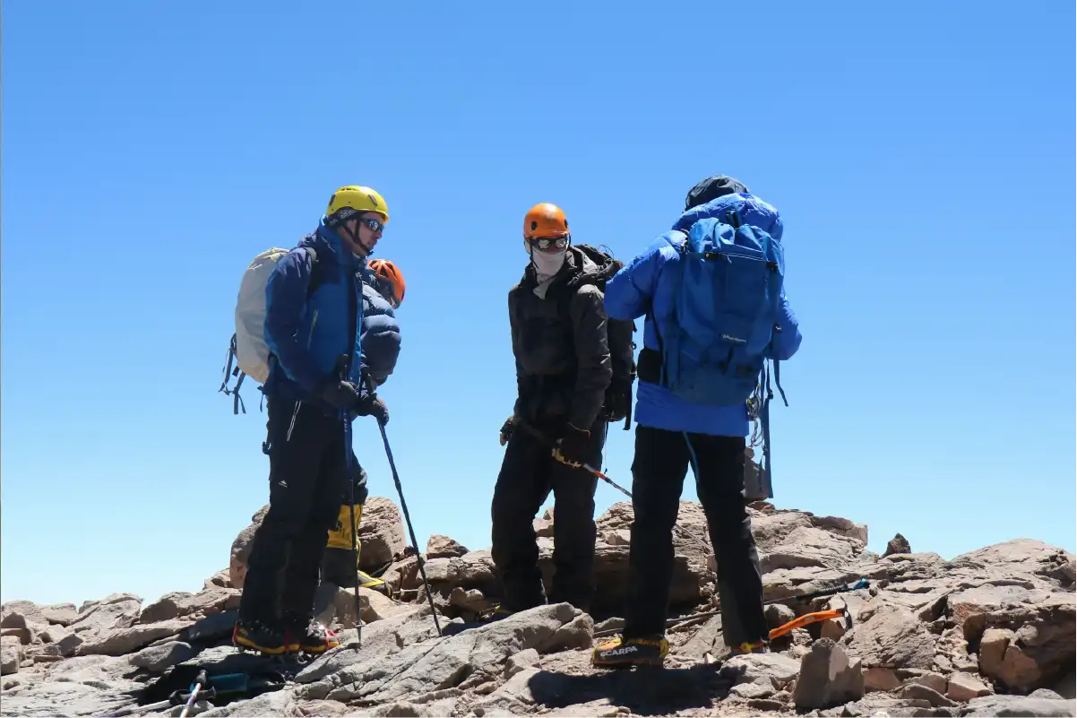 Hiker training with weighted backpack on hilly trail during Kilimanjaro preparation