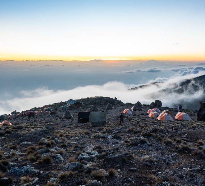 Climbers resting in tents during a stop on the Machame Route of Mount Kilimanjaro
