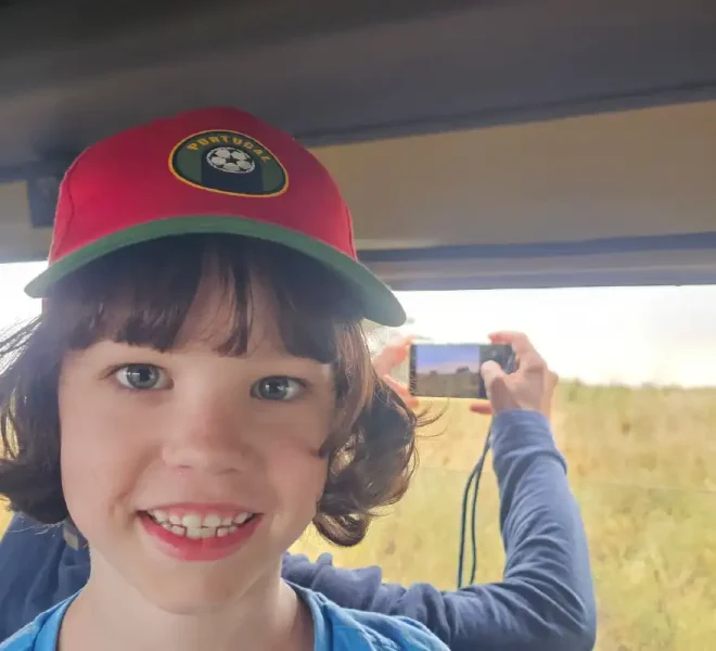 family-safari-adventure-beautiful-child-taking-selfie-with-her-mother-taking-photo-of-elephant-outside-the-window